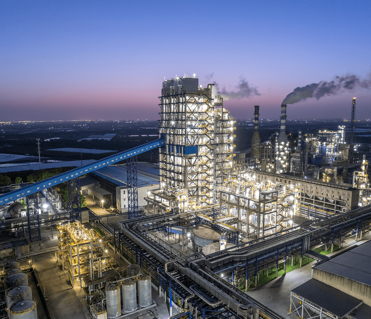 Factory skyline under twilight sky